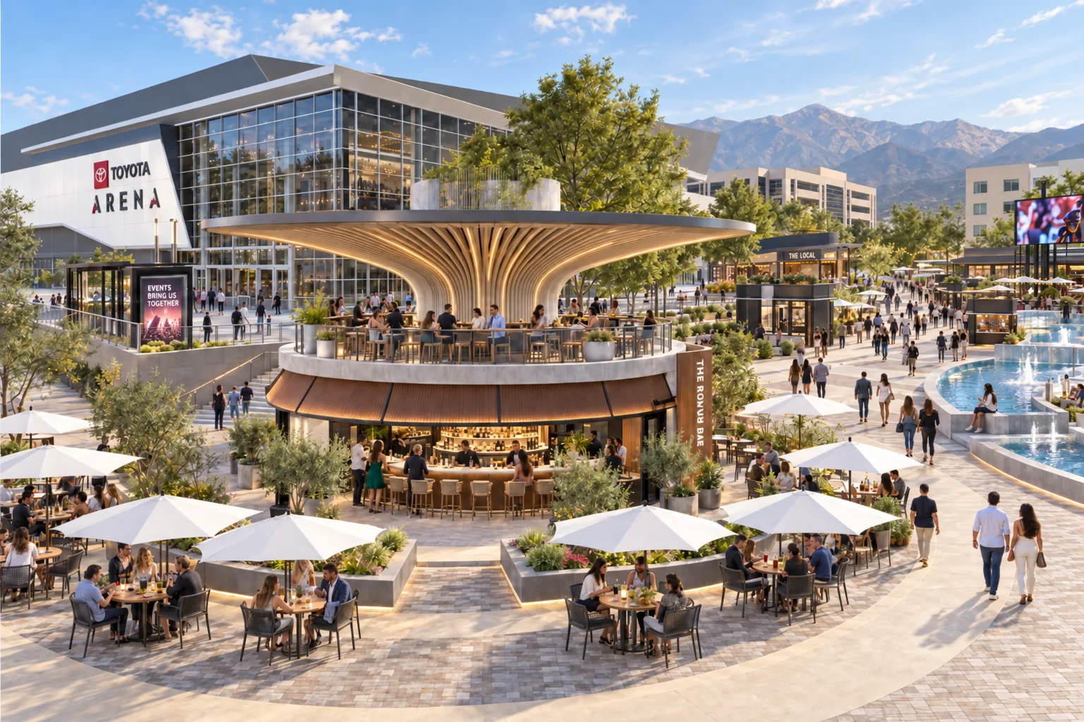 The Plaza by day: the Round Bar and its patios, Toyota Arena behind and the mountains beyond