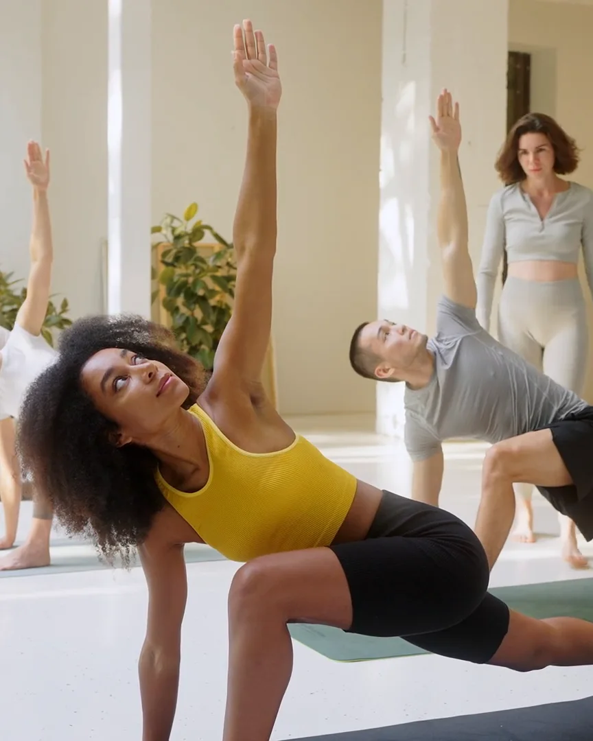 Residents stretching in a bright fitness studio